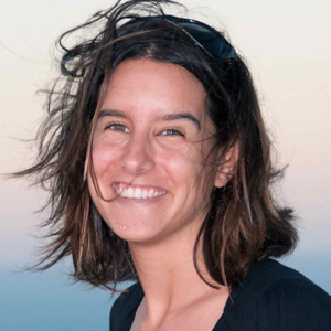 Woman with brown hair wearing black shirt