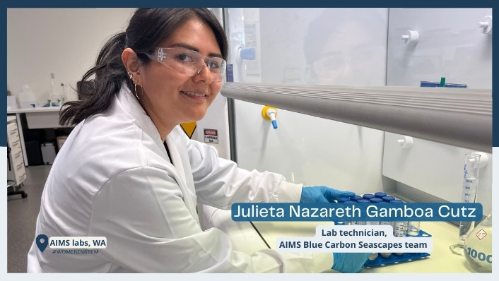 person smiling at camera at fume hood