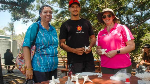 AIMS scientists with Traditional Owner with reef shapes